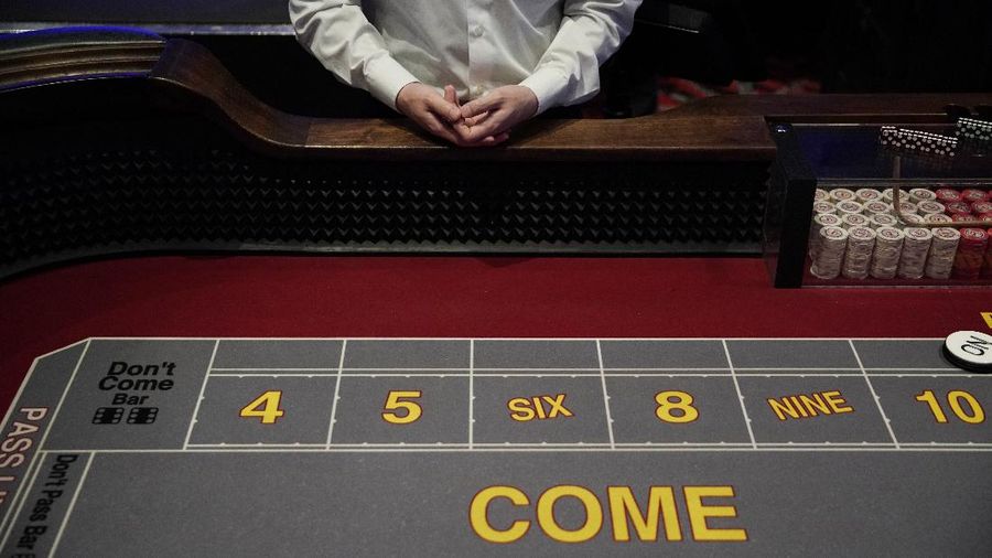 Chairs sit on pallets as some are being removed from electronic slot machines to maintain social distancing between players at a closed Caesars Palace hotel and casino Thursday, May 21, 2020, in Las Vegas. Casino operators in Las Vegas are awaiting w