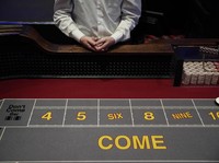 Chairs sit on pallets as some are being removed from electronic slot machines to maintain social distancing between players at a closed Caesars Palace hotel and casino Thursday, May 21, 2020, in Las Vegas. Casino operators in Las Vegas are awaiting w