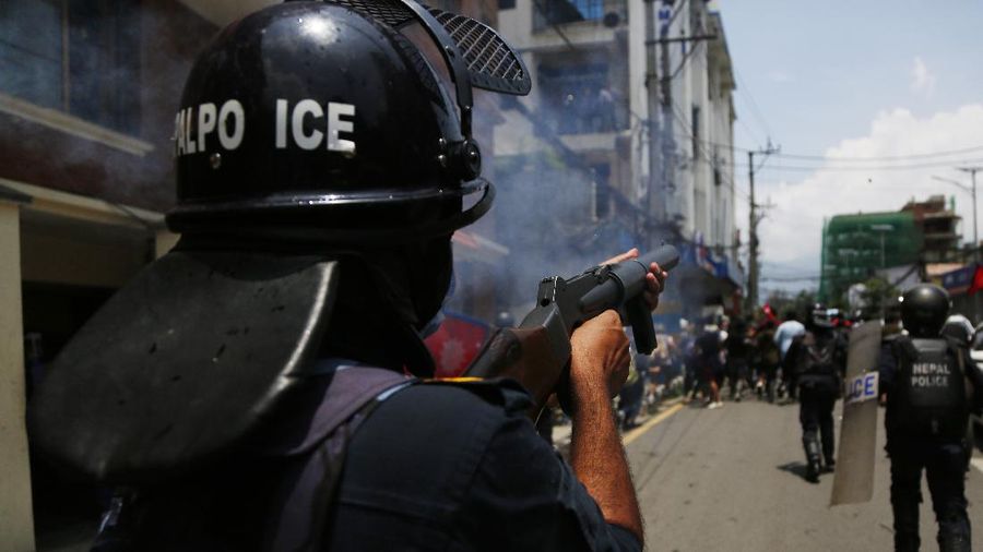 Nepalese police use water cannon to disperse youth who gathered for a protest near prime minister's residence demanding better handling of the COVID-19 pandemic in Kathmandu, Nepal, Thursday, June 11, 2020. About 1000 protesters had gathered demanding increased testing and alleging corruption by government officials while purchasing equipment and testing kits. (AP Photo/Niranjan Shrestha)