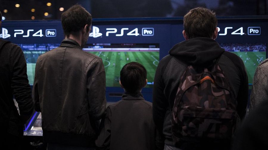 The logo of home video game console PS4 is pictured at the Paris games week in Paris, Saturday, Nov. 4, 2017. (AP Photo/Christophe Ena)