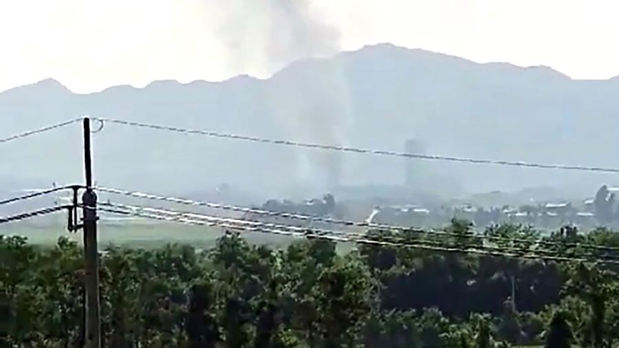 Smoke raising in the North Korean border town of Kaesong is seen from Paju, South Korea, Tuesday, June 16, 2020. North Korea blew up an inter-Korean liaison office building just inside its border in an act Tuesday that sharply raises tensions on the Korean Peninsula amid deadlocked nuclear diplomacy with the United States. (Yonhap via AP)