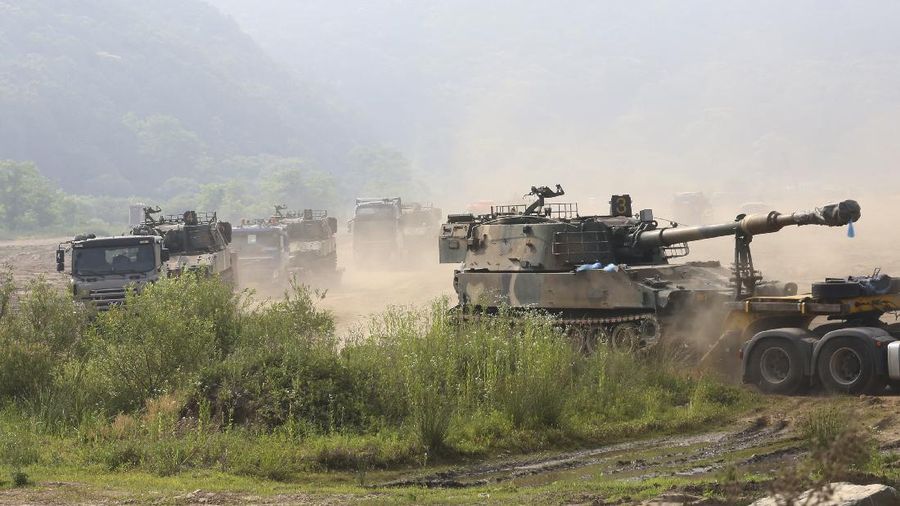 South Korean army's K-55 self-propelled howitzers loading on vehicles are moved in Paju, near the border with North Korea, South Korea, Wednesday, June 17, 2020. North Korea said Wednesday it will redeploy troops to now-shuttered inter-Korean tourism and economic sites near the border with South Korea and take other steps to nullify landmark 2018 tension-reduction deals. (AP Photo/Ahn Young-joon)