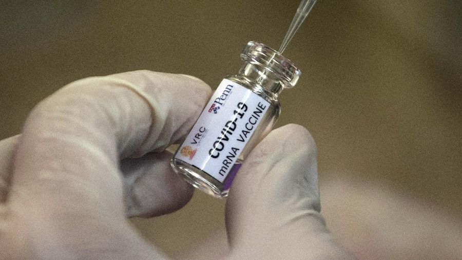 FILE - In this May 25, 2020, file photo, a lab technician extracts a portion of a COVID-19 vaccine candidate during testing at the Chula Vaccine Research Center, run by Chulalongkorn University in Bangkok, Thailand. As the race for a vaccine against the new coronavirus intensifies, many rich countries are rushing to the front of the line by placing advance orders for the inevitably limited supply to guarantee their citizens are immunized first.  (AP Photo/Sakchai Lalit, File)