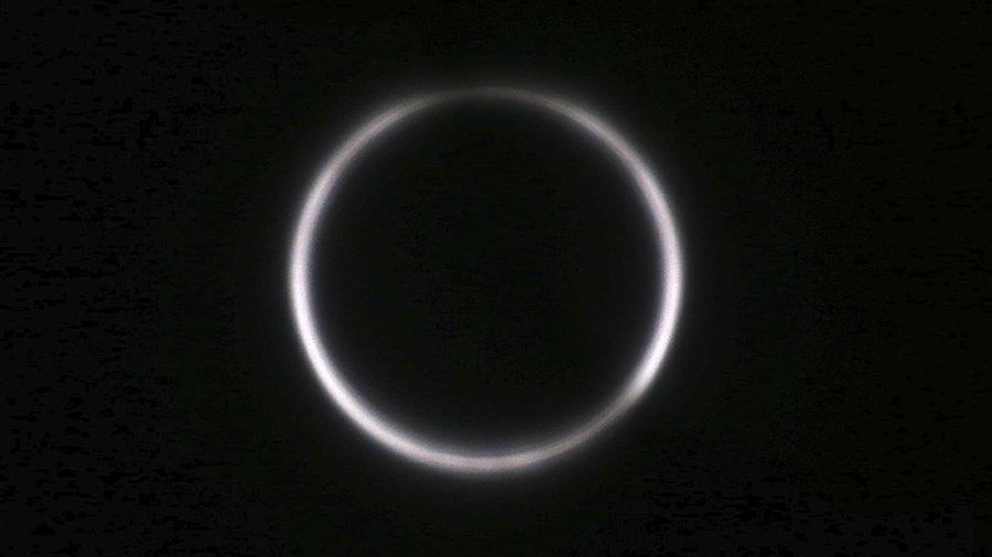 A solar eclipse is seen though Astro Solar glass in Chiayi City, southwest of Taiwan, Sunday, June 21, 2020. (AP Photo/Chiang Ying-ying)