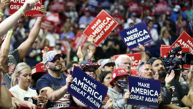 President Donald Trump reacts to applause from his supporters during his campaign rally at BOK Center in Tulsa, Okla., Saturday, June 20, 2020. (Ian Maule/Tulsa World via AP)
