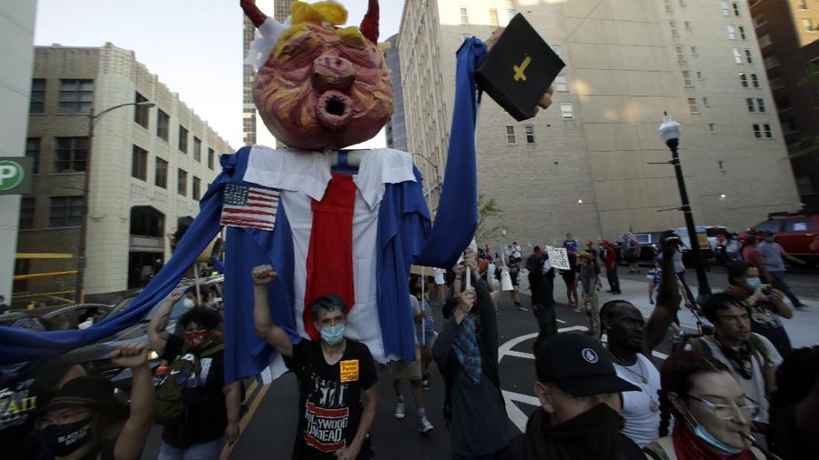 President Donald Trump reacts to applause from his supporters during his campaign rally at BOK Center in Tulsa, Okla., Saturday, June 20, 2020. (Ian Maule/Tulsa World via AP)