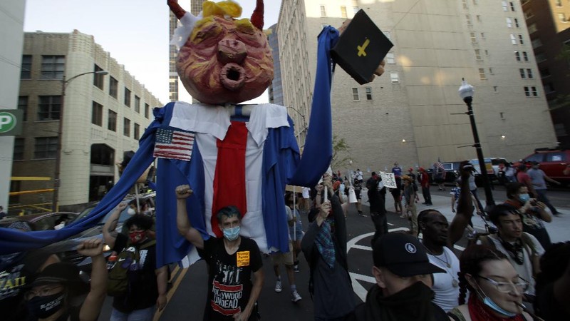 President Donald Trump reacts to applause from his supporters during his campaign rally at BOK Center in Tulsa, Okla., Saturday, June 20, 2020. (Ian Maule/Tulsa World via AP)