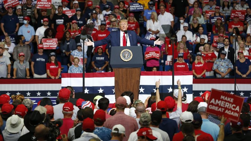 President Donald Trump reacts to applause from his supporters during his campaign rally at BOK Center in Tulsa, Okla., Saturday, June 20, 2020. (Ian Maule/Tulsa World via AP)