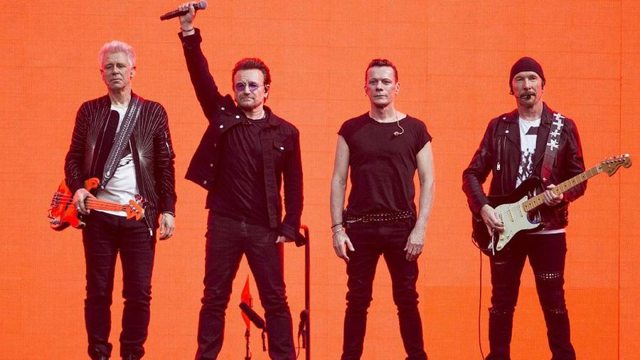 Musicians, Adam Clayton, from left, Bono, Larry Mullan Jnr and The Edge, of the band U2, perform on stage at Twickenham Stadium in London, Sunday, July 9, 2017. (Photo by Joel Ryan/Invision/AP)