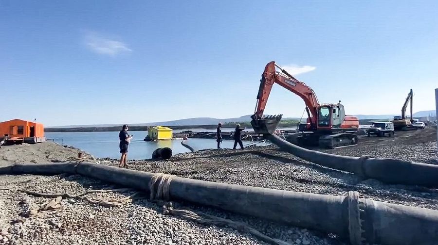 In this handout frame taken from video released Sunday June 28, 2020, by Novaya Gazeta, showing what the report is water from a Norilsk Nickel enrichment plant gushing out of a pipe and into a river which also runs into the lake near Norilsk, 2,900 kilometers (1,800 miles) northeast of Moscow, Russia. Russia's main criminal investigation body has launched a probe after a report that a nickel-processing plant was pumping water contaminated with heavy metals into the Arctic tundra.  (Elena Kostyuchenko, Novaya Gazeta via AP)