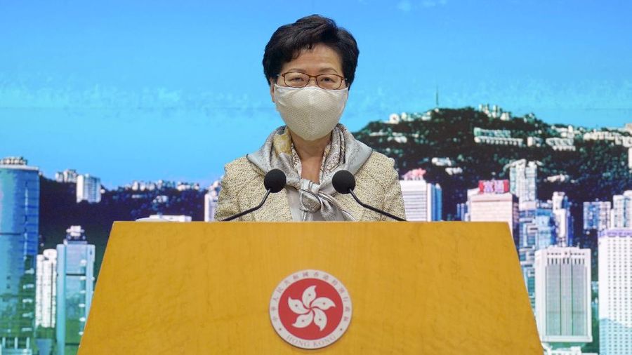 Hong Kong Chief Executive Carrie Lam listens to reporters' questions during a press conference in Hong Kong, Tuesday, June 30, 2020.  Hong Kong media are reporting that China has approved a contentious law that would allow authorities to crack down on subversive and secessionist activity in Hong Kong, sparking fears that it would be used to curb opposition voices in the semi-autonomous territory. Lam declined to comment on the national security law at a weekly meeting with reporters, saying it was “inappropriate” for her to do so while the Standing Committee meeting was still in progress.(AP Photo/Vincent Yu)