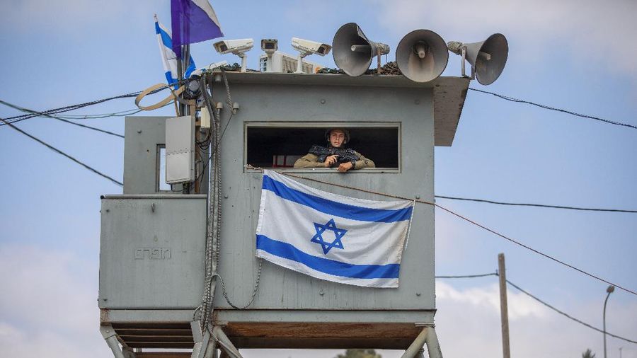 An Israeli soldier stands guard at the Tapuach junction next to the West Bank city of Nablus, Tuesday, June 30, 2020. Israeli Prime Minister Benjamin Netanyahu appears determined to carry out his pledge to begin annexing parts of the occupied West Bank, possibly as soon as Wednesday. (AP Photo/Oded Balilty)
