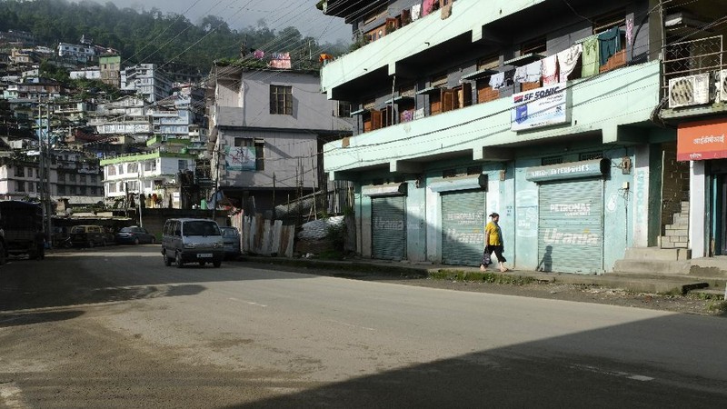 An Indian man wearing a face mask as a precaution against the coronavirus sleeps outside closed shops during the reimposed lockdown in Gauhati, India, Monday, June 29, 2020. India has reported a new daily record of nearly 20,000 new infections as several Indian states reimpose partial or full lockdowns to stem the spread of the coronavirus. (AP Photo/Anupam Nath)