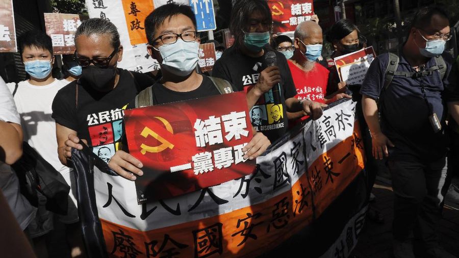 Protesters against the new national security law march on the anniversary of Hong Kong's handover to China from Britain in Hong Kong, Wednesday, July. 1, 2020. Hong Kong marked the 23rd anniversary of its handover to China in 1997, and just one day after China enacted a national security law that cracks down on protests in the territory. (AP Photo/Vincent Yu)