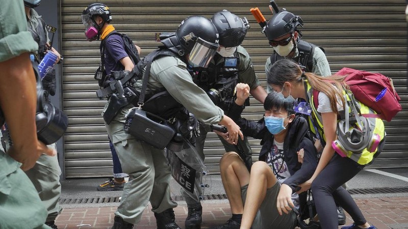 Protesters against the new national security law march on the anniversary of Hong Kong's handover to China from Britain in Hong Kong, Wednesday, July. 1, 2020. Hong Kong marked the 23rd anniversary of its handover to China in 1997, and just one day after China enacted a national security law that cracks down on protests in the territory. (AP Photo/Vincent Yu)