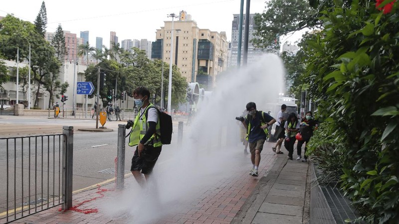 Protesters against the new national security law march on the anniversary of Hong Kong's handover to China from Britain in Hong Kong, Wednesday, July. 1, 2020. Hong Kong marked the 23rd anniversary of its handover to China in 1997, and just one day after China enacted a national security law that cracks down on protests in the territory. (AP Photo/Vincent Yu)