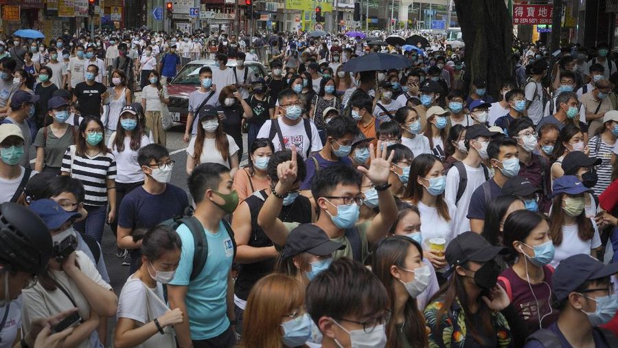 Protesters against the new national security law march on the anniversary of Hong Kong's handover to China from Britain in Hong Kong, Wednesday, July. 1, 2020. Hong Kong marked the 23rd anniversary of its handover to China in 1997, and just one day after China enacted a national security law that cracks down on protests in the territory. (AP Photo/Vincent Yu)