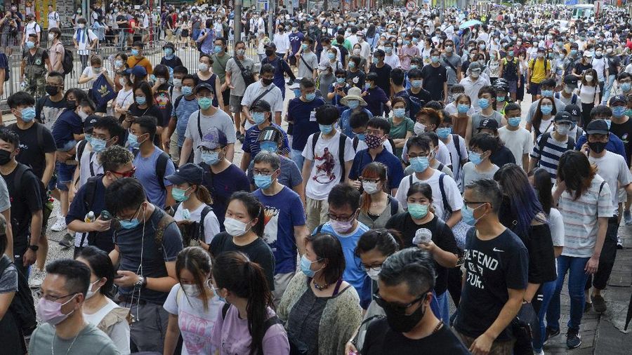 Protesters against the new national security law march on the anniversary of Hong Kong's handover to China from Britain in Hong Kong, Wednesday, July. 1, 2020. Hong Kong marked the 23rd anniversary of its handover to China in 1997, and just one day after China enacted a national security law that cracks down on protests in the territory. (AP Photo/Vincent Yu)