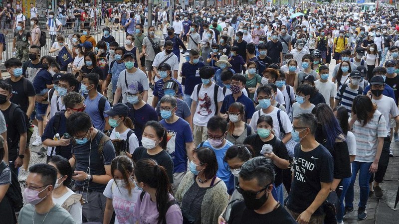 Protesters against the new national security law march on the anniversary of Hong Kong's handover to China from Britain in Hong Kong, Wednesday, July. 1, 2020. Hong Kong marked the 23rd anniversary of its handover to China in 1997, and just one day after China enacted a national security law that cracks down on protests in the territory. (AP Photo/Vincent Yu)