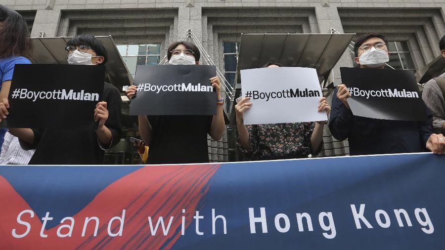 Supporters of Hong Kong protesters stage a rally calling for a boycott of the Disney-produced film 
