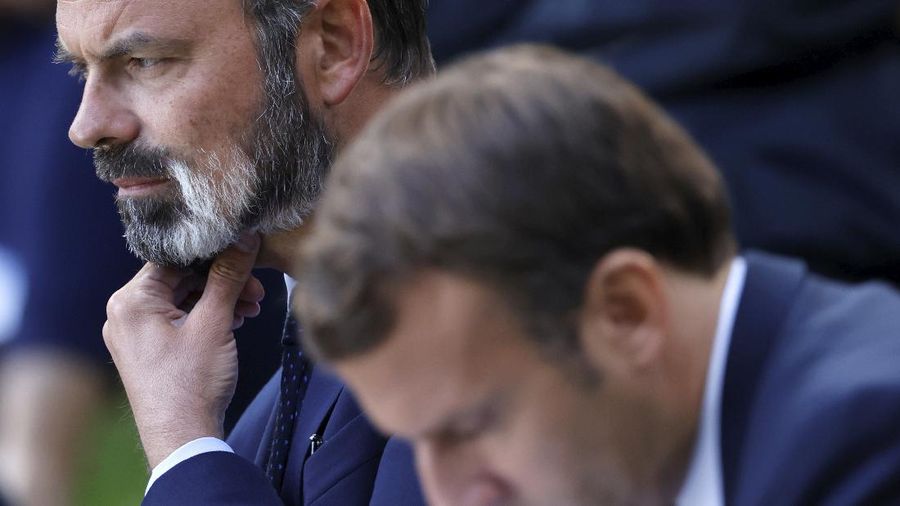 French President Emmanuel Macron, right, and French Prime Minister Edouard Philippe attend a meeting with members of the Citizens' Convention on Climate to discuss over environment proposals at the Elysee Palace in Paris, Monday, June 29, 2020. French President Emmanuel Macron, who once declared 
