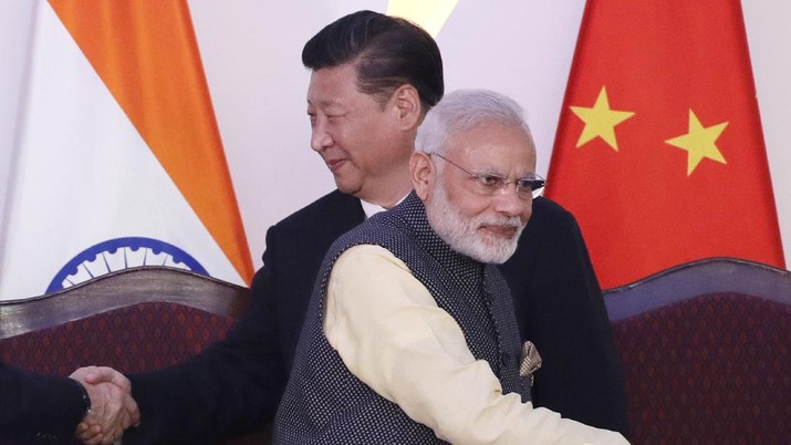 China India Standoff In this Oct. 16, 2016, file photo, Indian Prime Minister Narendra Modi, front and Chinese President Xi Jinping shake hands with leaders at the BRICS summit in Goa, India. Modi made an unannounced visit Friday, July 3, 2020, to a military base in remote Ladakh region bordering China where the soldiers of the two countries have been facing off for nearly two months. Modi’s visit comes in the backdrop of massive Indian army build-up in Ladakh region following hand-to-hand combat between Indian and Chinese soldiers on June 15 that left 20 Indian soldiers dead and dozens injured, the worst military confrontation in over four decades between the Asian giants. (AP Photo/Manish Swarup, File)