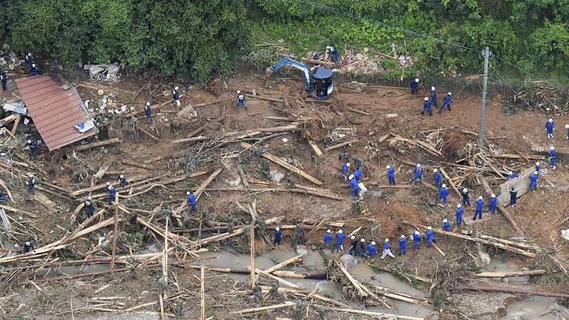 A road is damaged following a heavy rain in Kumamura, Kumamoto prefecture, southern Japan Saturday, July 4, 2020. Heavy rain in southern Japan triggered flooding and mudslides on Saturday, leaving more than a dozen people presumed dead, some missing and dozens stranded on rooftops waiting to be rescued, officials said. (Kyodo News via AP)