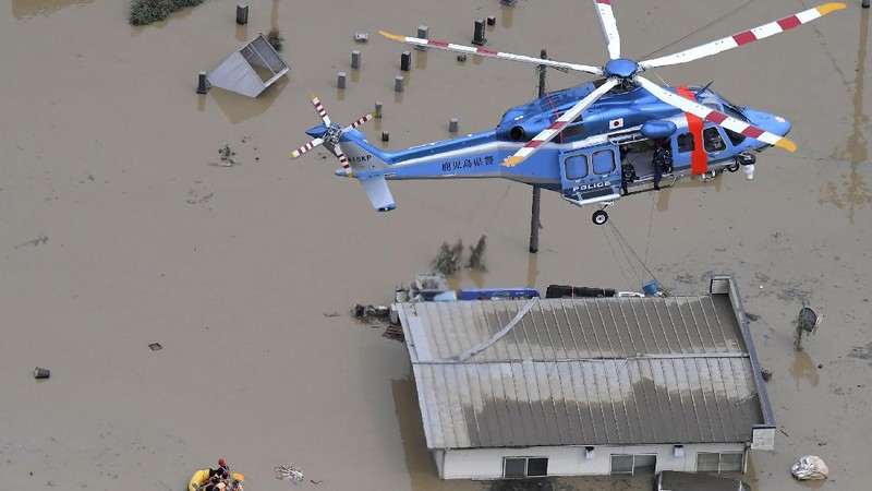 A road is damaged following a heavy rain in Kumamura, Kumamoto prefecture, southern Japan Saturday, July 4, 2020. Heavy rain in southern Japan triggered flooding and mudslides on Saturday, leaving more than a dozen people presumed dead, some missing and dozens stranded on rooftops waiting to be rescued, officials said. (Kyodo News via AP)