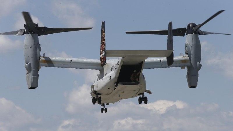 In this Friday, May 17, 2019, photo released by the U.S. Navy, Aviation Boatswain's Mate 2nd Class Nicholas Hawkins, from Houston, Texas, signals an MV-22 Osprey to land on the flight deck of the Nimitz-class aircraft carrier USS Abraham Lincoln in the Arabian Sea. Commercial airliners flying over the Persian Gulf risk being targeted by 