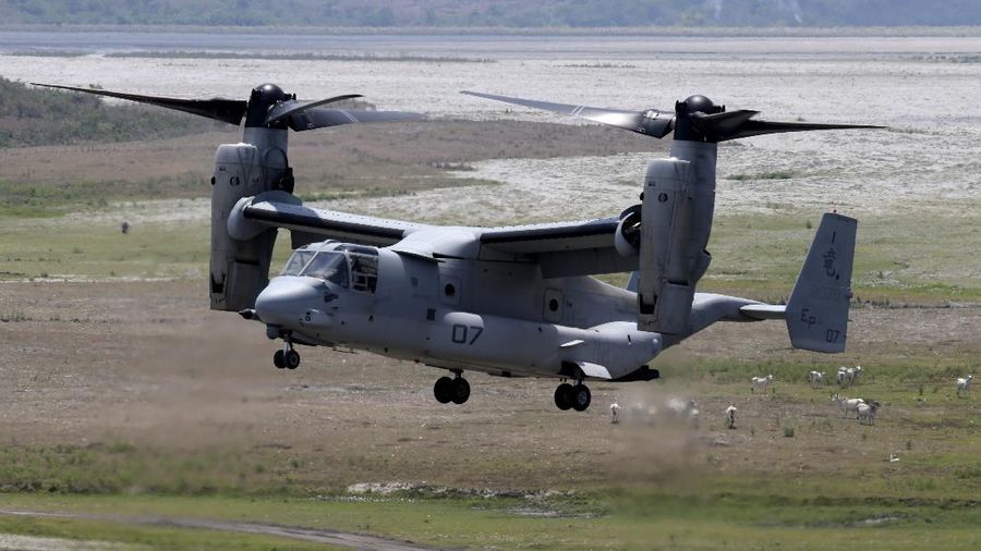 In this Friday, May 17, 2019, photo released by the U.S. Navy, Aviation Boatswain's Mate 2nd Class Nicholas Hawkins, from Houston, Texas, signals an MV-22 Osprey to land on the flight deck of the Nimitz-class aircraft carrier USS Abraham Lincoln in the Arabian Sea. Commercial airliners flying over the Persian Gulf risk being targeted by 