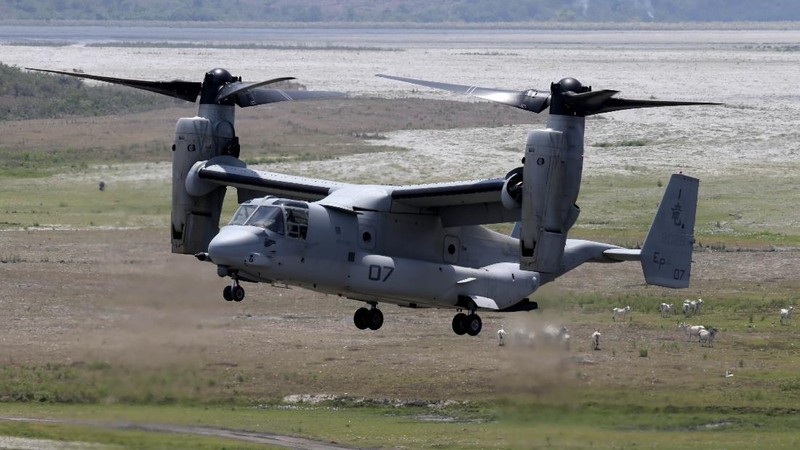 In this Friday, May 17, 2019, photo released by the U.S. Navy, Aviation Boatswain's Mate 2nd Class Nicholas Hawkins, from Houston, Texas, signals an MV-22 Osprey to land on the flight deck of the Nimitz-class aircraft carrier USS Abraham Lincoln in the Arabian Sea. Commercial airliners flying over the Persian Gulf risk being targeted by 