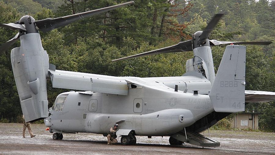 In this Friday, May 17, 2019, photo released by the U.S. Navy, Aviation Boatswain's Mate 2nd Class Nicholas Hawkins, from Houston, Texas, signals an MV-22 Osprey to land on the flight deck of the Nimitz-class aircraft carrier USS Abraham Lincoln in the Arabian Sea. Commercial airliners flying over the Persian Gulf risk being targeted by 