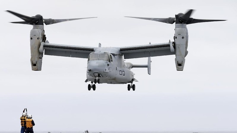 In this Friday, May 17, 2019, photo released by the U.S. Navy, Aviation Boatswain's Mate 2nd Class Nicholas Hawkins, from Houston, Texas, signals an MV-22 Osprey to land on the flight deck of the Nimitz-class aircraft carrier USS Abraham Lincoln in the Arabian Sea. Commercial airliners flying over the Persian Gulf risk being targeted by 