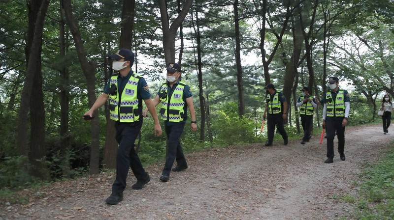 Rescuers arrive to search for missing Seoul Mayor Park Won-soon in Seoul, South Korea, Thursday, July 9, 2020. Police say Park has been reported missing and search operations are underway. (Lee Young-hwan/Newsis via AP)