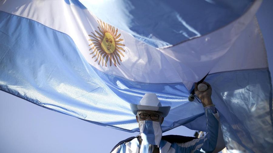 A man takes part in protest against the government-ordered lockdown to curb the spread of the new coronavirus in Buenos Aires, Argentina, Thursday, July 9, 2020. People protested across the country, the Independence Day holiday, the handling of the pandemic by the administration of President Alberto Fernandez. (AP Photo/Natacha Pisarenko)