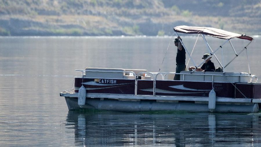 Members of Ventura County Sheriff's Office Underwater Search and Rescue Team search for former 