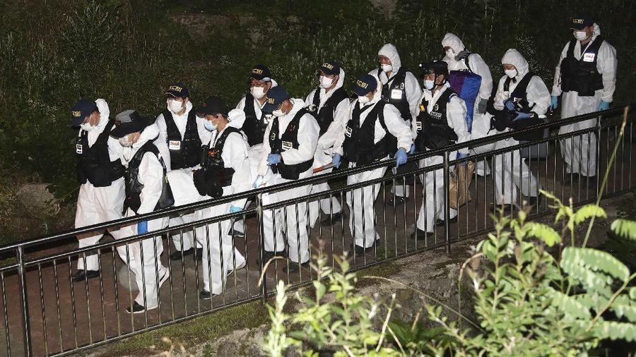 Rescuers arrive to search for missing Seoul Mayor Park Won-soon in Seoul, South Korea, Thursday, July 9, 2020. Police say Park has been reported missing and search operations are underway. (Lee Young-hwan/Newsis via AP)