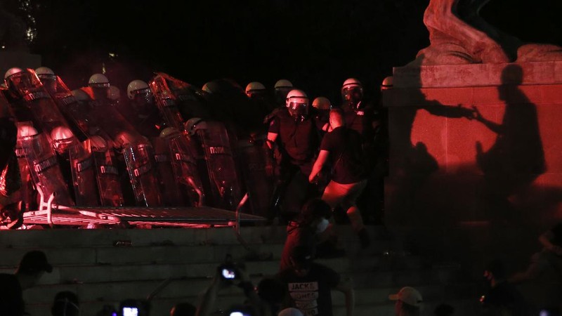 Protesters hold an icon during a protest in front of Serbian Parliament building in Belgrade, Serbia, Friday, July 10 2020. Serbia's President Aleksandar Vucic said Friday he's not worried about losing political power amid large protests against his handling of the coronavirus crisis and hard-line rule, but instead expressed his fear about the spread of the virus by the demonstrators. The spontaneous protests started on Tuesday when Vucic announced that Belgrade would be placed under a new three-day lockdown following a second wave of confirmed coronavirus infections. (AP Photo/Darko Vojinovic)