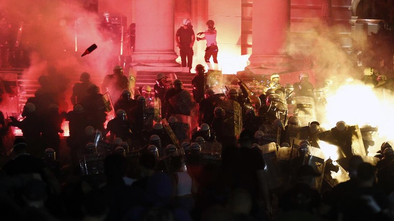 Protesters hold an icon during a protest in front of Serbian Parliament building in Belgrade, Serbia, Friday, July 10 2020. Serbia's President Aleksandar Vucic said Friday he's not worried about losing political power amid large protests against his handling of the coronavirus crisis and hard-line rule, but instead expressed his fear about the spread of the virus by the demonstrators. The spontaneous protests started on Tuesday when Vucic announced that Belgrade would be placed under a new three-day lockdown following a second wave of confirmed coronavirus infections. (AP Photo/Darko Vojinovic)