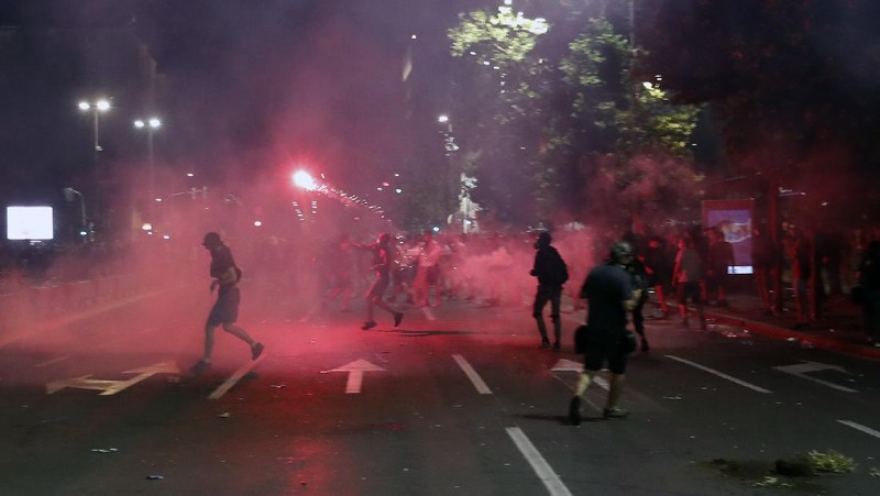 Protesters hold an icon during a protest in front of Serbian Parliament building in Belgrade, Serbia, Friday, July 10 2020. Serbia's President Aleksandar Vucic said Friday he's not worried about losing political power amid large protests against his handling of the coronavirus crisis and hard-line rule, but instead expressed his fear about the spread of the virus by the demonstrators. The spontaneous protests started on Tuesday when Vucic announced that Belgrade would be placed under a new three-day lockdown following a second wave of confirmed coronavirus infections. (AP Photo/Darko Vojinovic)
