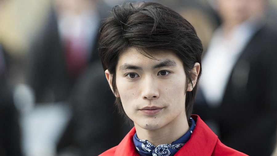 Japanese actor and singer Haruma Miura attends the Louis Vuitton men's Fall-Winter 2014-2015 fashion collection, presented Thursday, Jan. 16, 2014 in Paris. (AP Photo/Jacques Brinon)
