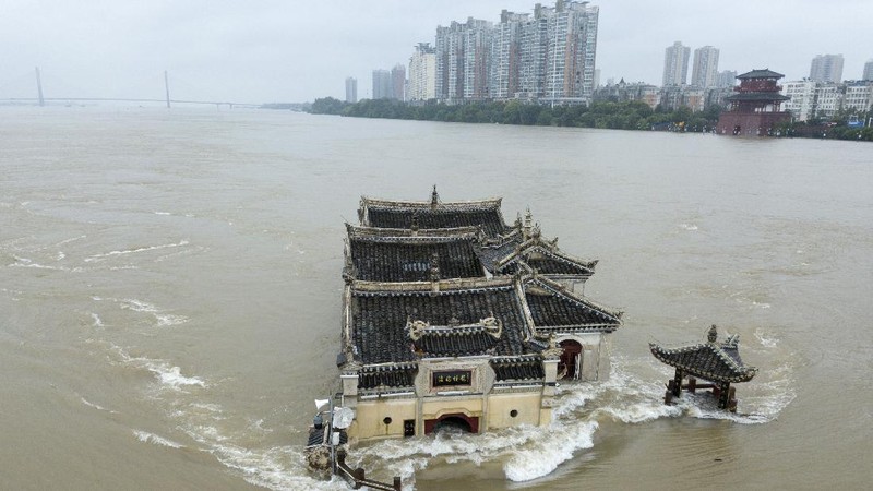 In this photo released by Xinhua News Agency, an aerial photo shows the extent of flooding in Guzhen Town of Lu'an City in eastern China's Anhui Province on Monday, July 20, 2020. (Tang Yang/Xinhua via AP)