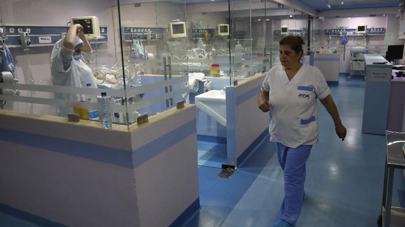 Nurses work at the neonatal intensive care unit, at Family Medical Center, a private hospital facing financial difficulties, in Majdalaiya village, north Lebanon, Thursday, July 16, 2020. Just as Lebanon faces a surge in coronavirus cases, hospitals are cracking under the country's financial crisis. They are struggling to pay staff, keep equipment running or even stay open amid shortages in key supplies like anesthesia and sutures. The health sector has long been one of the best in the Middle East, with its private hospitals drawing patients from around the region. But with dollars in short supply and the state unable to pay insurance bills, hospitals are having to turn away patients and close wards to cut costs. Public facilities, on the front line of the coronavirus fight, are too underfunded and understaffed to fill the gap. (AP Photo/Hussein Malla)