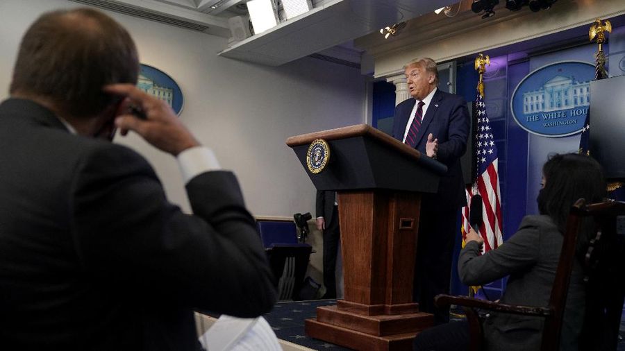 President Donald Trump arrives for a news conference at the White House, Tuesday, July 21, 2020, in Washington. (AP Photo/Evan Vucci)