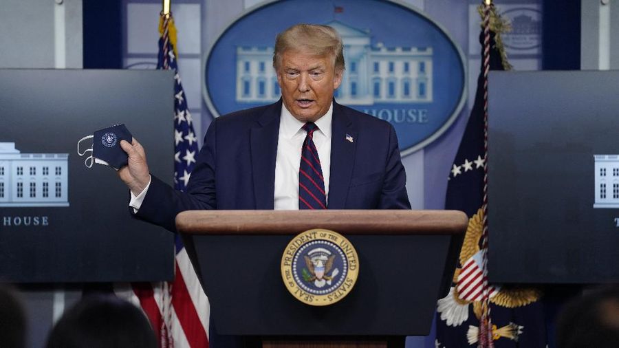 President Donald Trump arrives for a news conference at the White House, Tuesday, July 21, 2020, in Washington. (AP Photo/Evan Vucci)