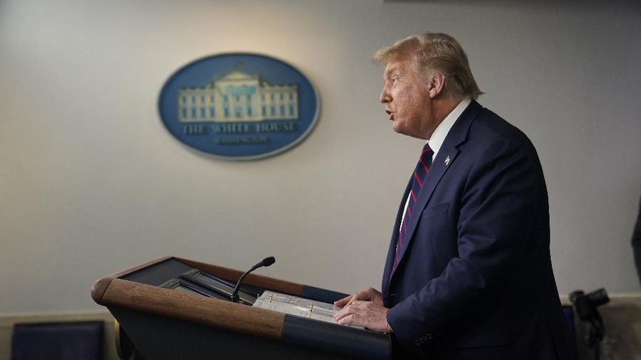 President Donald Trump arrives for a news conference at the White House, Tuesday, July 21, 2020, in Washington. (AP Photo/Evan Vucci)