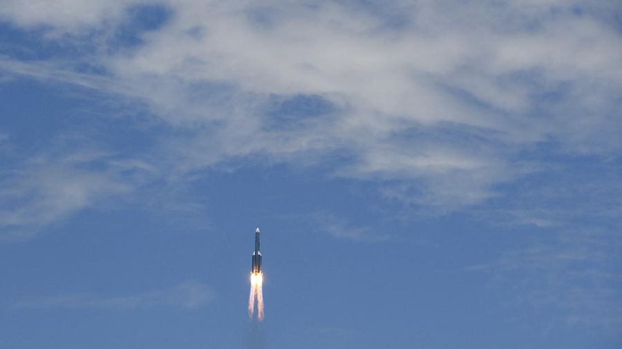 In this photo released by China's Xinhua News Agency, a Long March-5 rocket carrying the Tianwen-1 Mars probe lifts off from the Wenchang Space Launch Center in southern China's Hainan Province, Thursday, July 23, 2020. China launched its most ambitious Mars mission yet on Thursday in a bold attempt to join the United States in successfully landing a spacecraft on the red planet. (Cai Yang/Xinhua via AP)