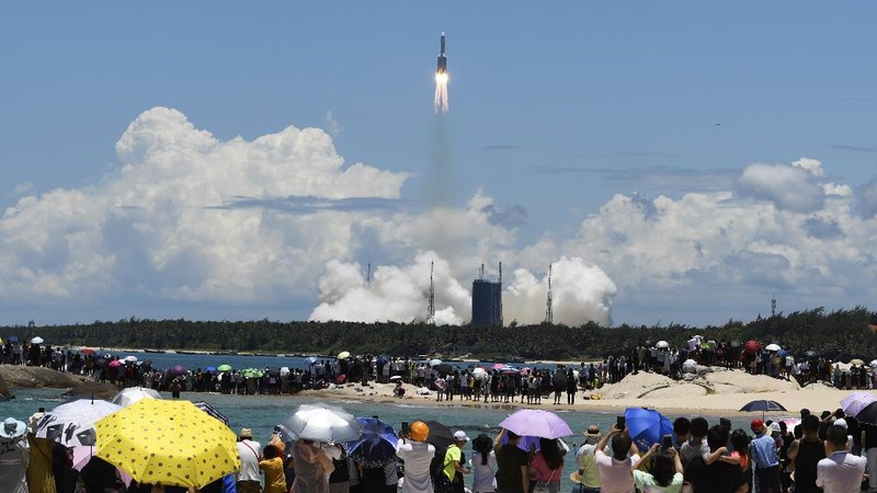 In this photo released by China's Xinhua News Agency, a Long March-5 rocket carrying the Tianwen-1 Mars probe lifts off from the Wenchang Space Launch Center in southern China's Hainan Province, Thursday, July 23, 2020. China launched its most ambitious Mars mission yet on Thursday in a bold attempt to join the United States in successfully landing a spacecraft on the red planet. (Cai Yang/Xinhua via AP)