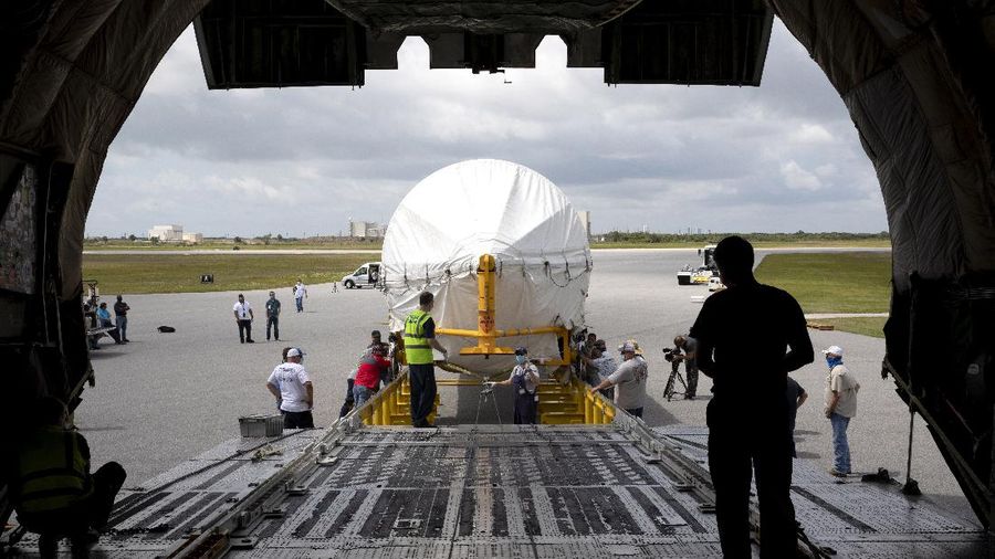 In this view from inside the Antonov 124 cargo aircraft, the United Launch Alliance booster for NASA’s Mars Perseverance rover is offloaded at the Skid Strip at Cape Canaveral Air Force Station (CCAFS) in Florida on May 19, 2020. The Mars Perseverance rover is scheduled to launch in mid-July atop a United Launch Alliance Atlas V 541 rocket from Pad 41 at CCAFS. The rover is part of NASA’s Mars Exploration Program, a long-term effort of robotic exploration of the Red Planet. The rover will search for habitable conditions in the ancient past and signs of past microbial life on Mars. The Launch Services Program at Kennedy is responsible for launch management.