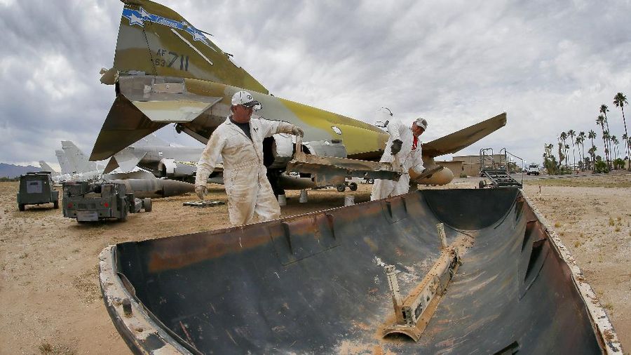 Lockheed C-5 Galaxy cargo jets are stored, as shown with this fisheye lens photograph, at the 309th Aerospace Maintenance and Regeneration Group boneyard Thursday, May 14, 2015 at Davis-Monthan Air Force Base in Tucson, Ariz. The C-5A Galaxy the largest aircraft in the U.S. armed services. (File Photo/AP Photo/Matt York)